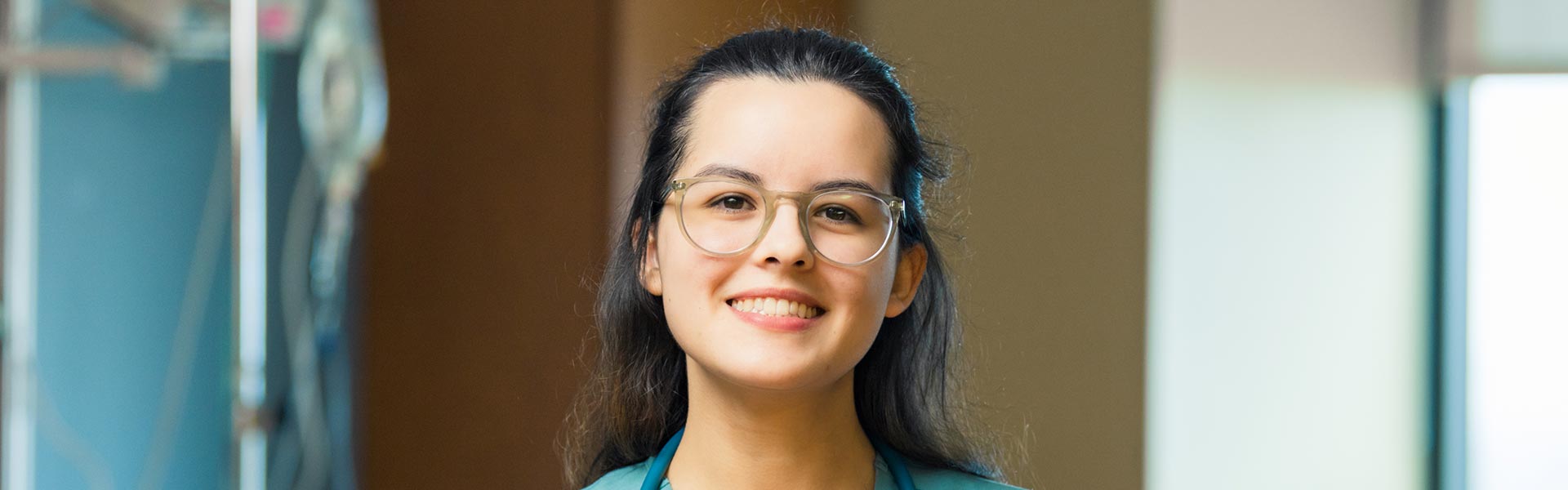 Young woman looking at the camera smiling