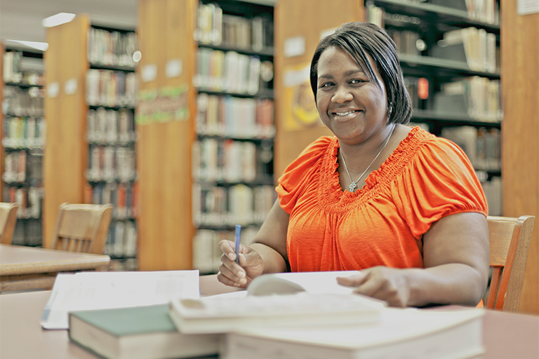 woman studying in library
