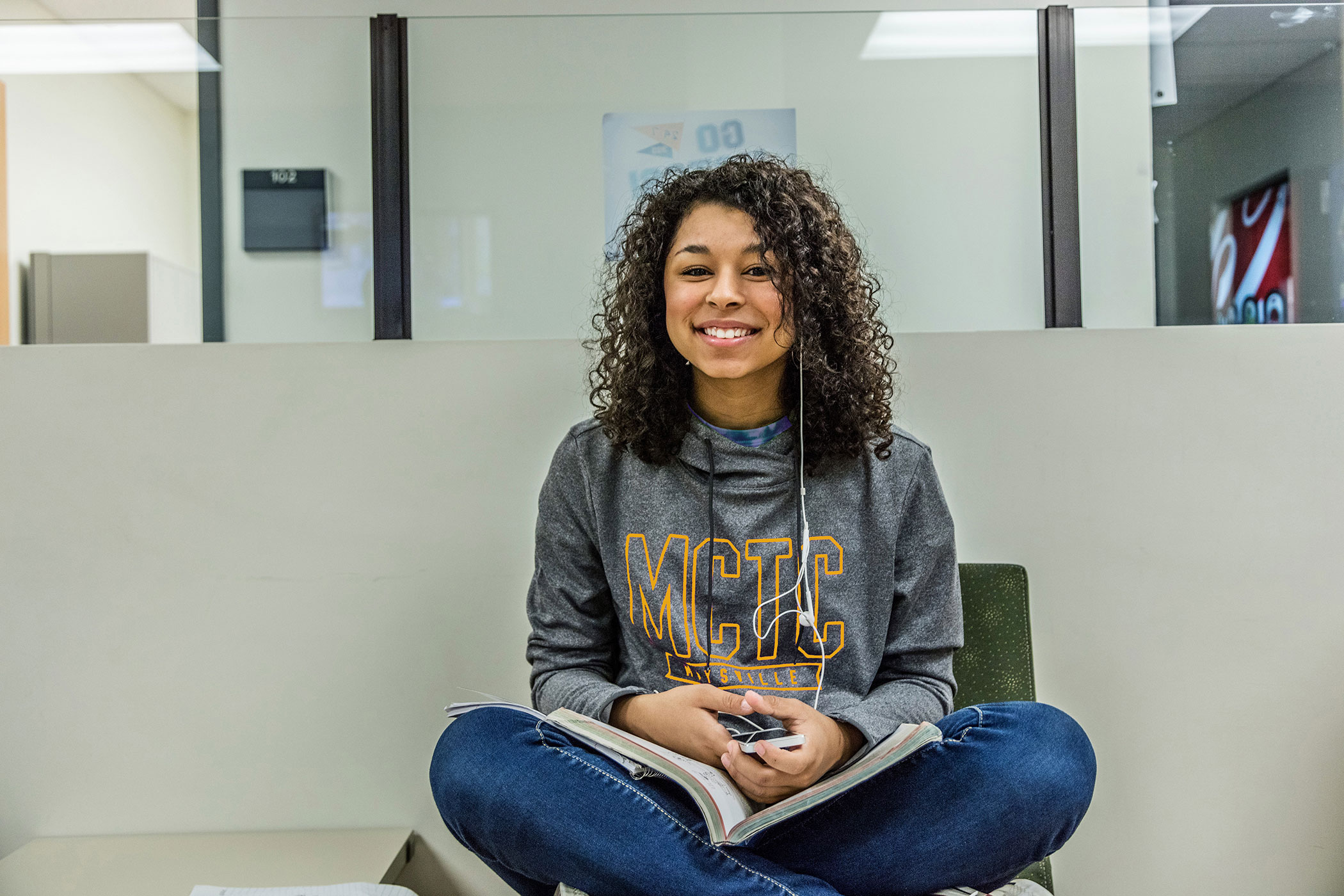 student sitting with crossed legs