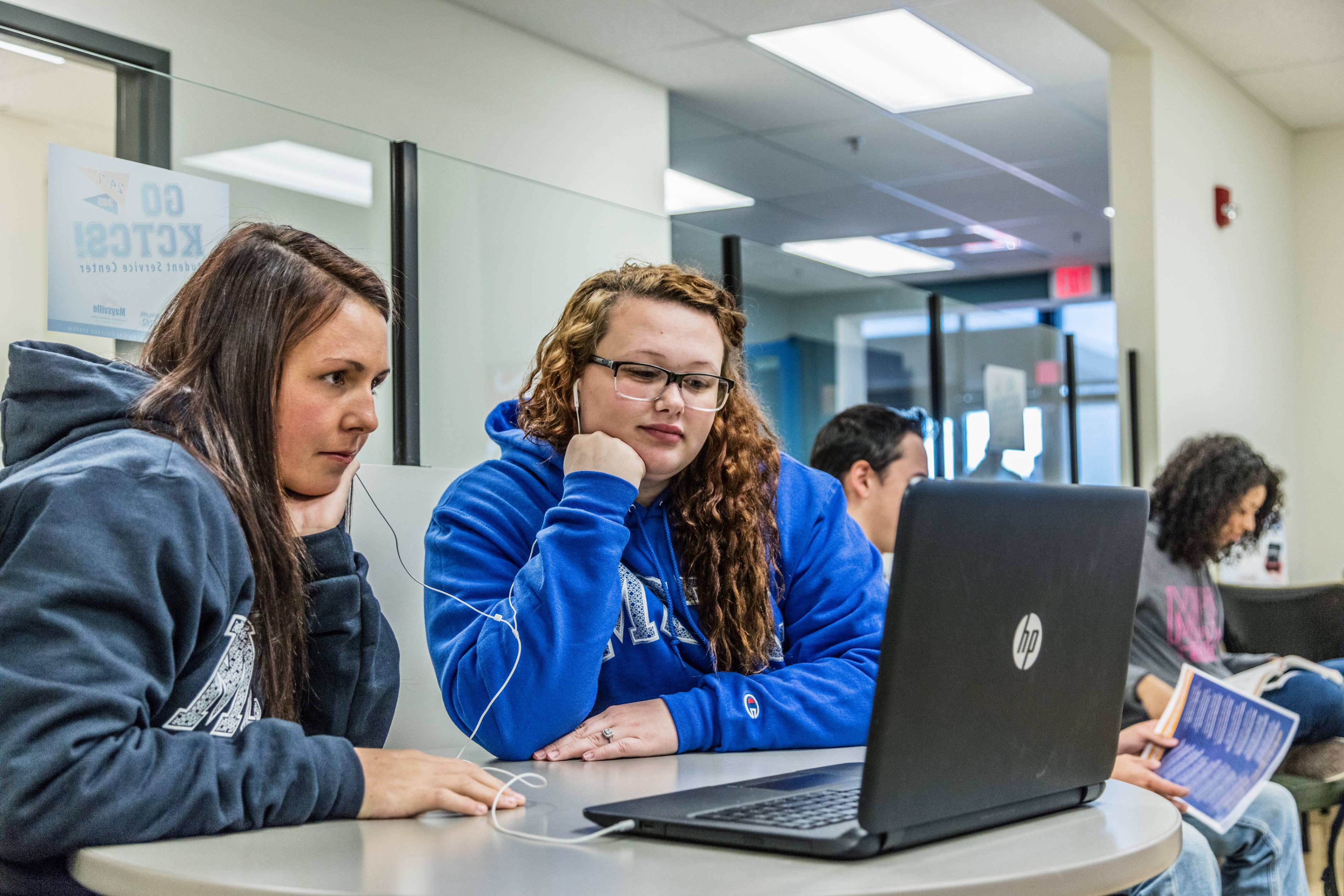 students working together on laptop